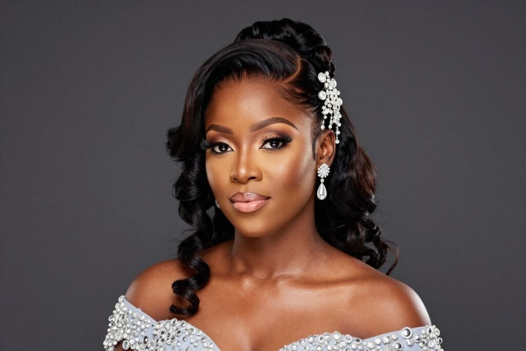 Black woman with elaborate half up half down hairstyle adorned with accessories for special occasions Black woman with elaborate half up half down hairstyle adorned with accessories for special occasions