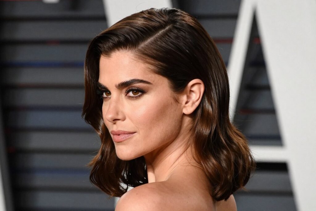 Woman with a half up side swept hairstyle for formal events